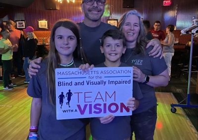 Family serving a blind organization and team